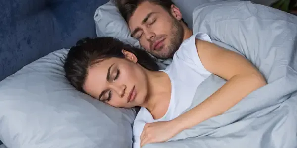 couple sleeping peacefully in bed bug free bed